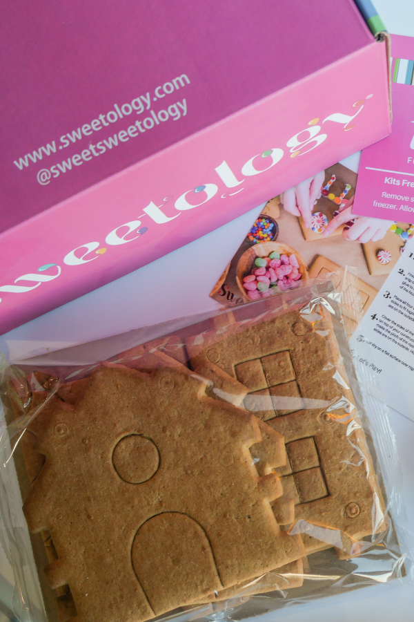 Sweetology gingerbread house decorating kit unboxing — pre-baked gingerbread panels, icing, candy, and instructions shipped to your door