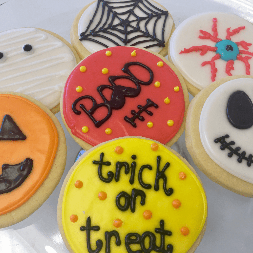 Halloween cookie decorating kit corporate virtual team building event party spooky idea fun office gift at home haunted gingerbread house holiday 2025